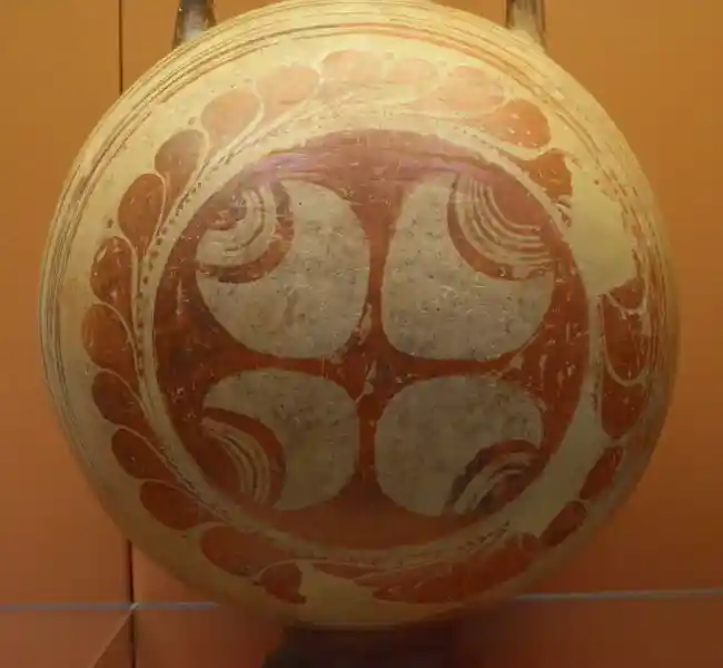 Cross formed from four circular leaves on a pottery globular flask